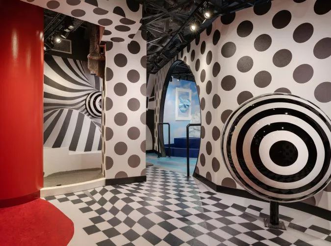 indoor mini golf course with black and white polka dots