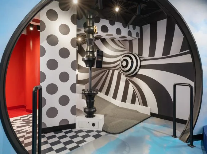 black and white optical illusion themed mini golf course