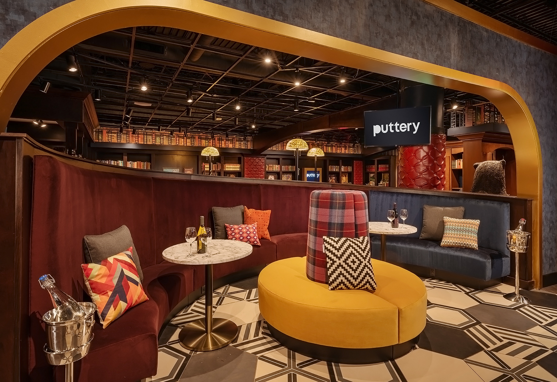 Puttery Charlotte in South End featuring the immersive Library and Conservatory indoor mini golf courses, craft cocktails and upscale dining.