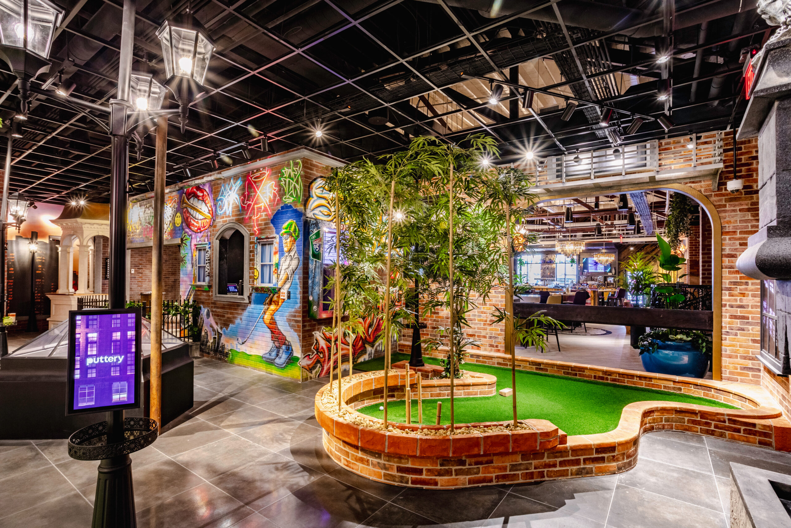 Puttery Miami in Wynwood featuring the Rooftop, Lodge and Library indoor mini golf courses, craft cocktails, nightlife and chef-driven dining.