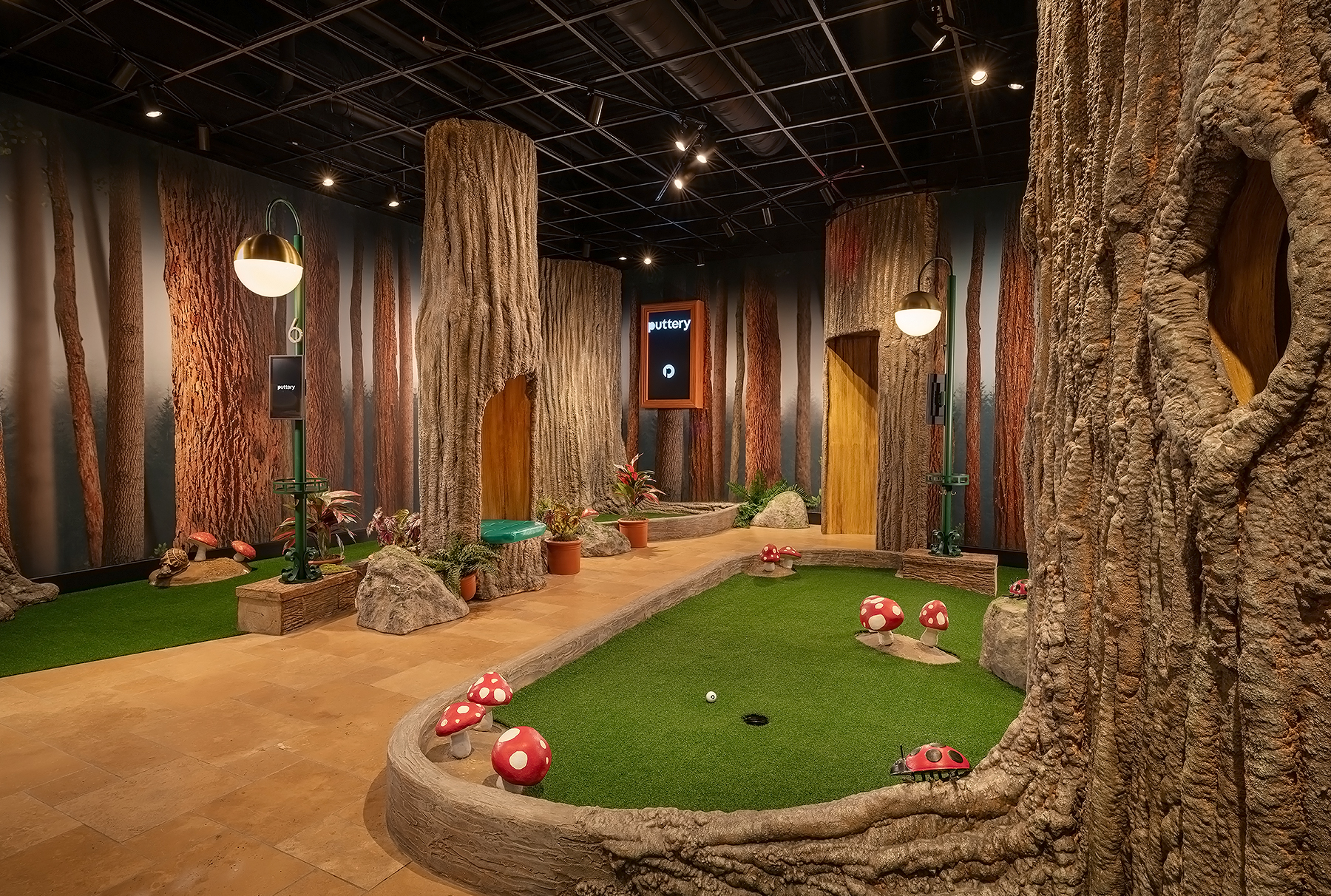Puttery Minneapolis in North Loop featuring the Art Museum, Conservatory and Library indoor mini golf courses, craft cocktails and upscale entertainment.