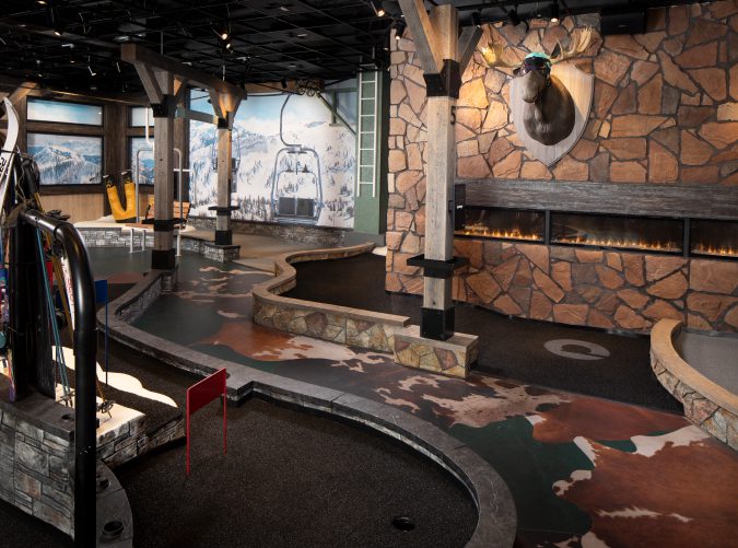 http://Cozy%20ski%20lodge%20themed%20mini-golf%20course%20at%20The%20Lodge%20with%20winter%20decorations.