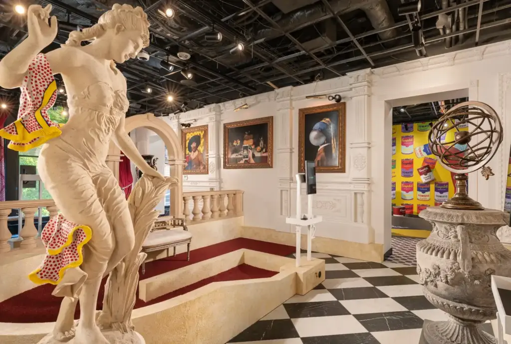Classical gallery-inspired mini golf hole with a large statue and framed artwork inside the Art Museum course at Puttery Washington DC.