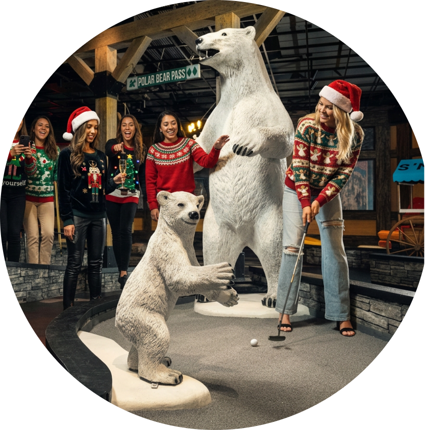 Friends in holiday sweaters play indoor mini golf on Puttery’s lodge-themed course with polar bear statues