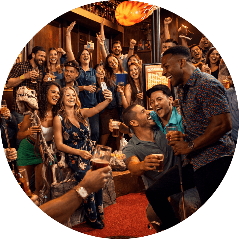 Group of friends at a lively bar party, cheering with drinks and smiles while posing for a photo.